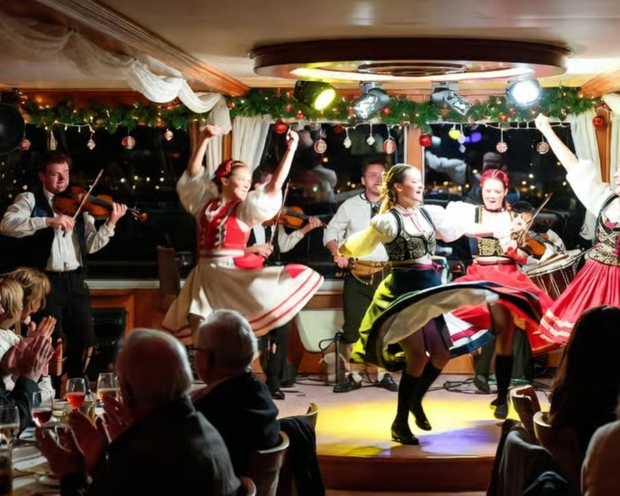Traditional Hungarian folk dancers and live musicians performing for guests aboard a festive Danube river cruise