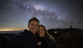 Couple beneath the Milky Way during a Mauna Kea stargazing experience in Hawaii
