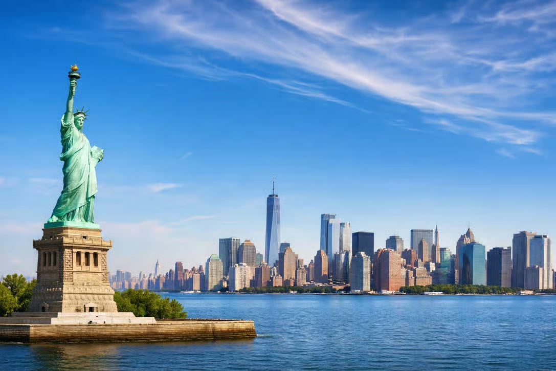 Statue of Liberty with Manhattan skyline during New York Italian heritage tour
