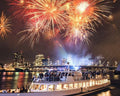Rotterdam New Year's Eve cruise on the Nieuwe Maas beneath fireworks near Erasmus Bridge