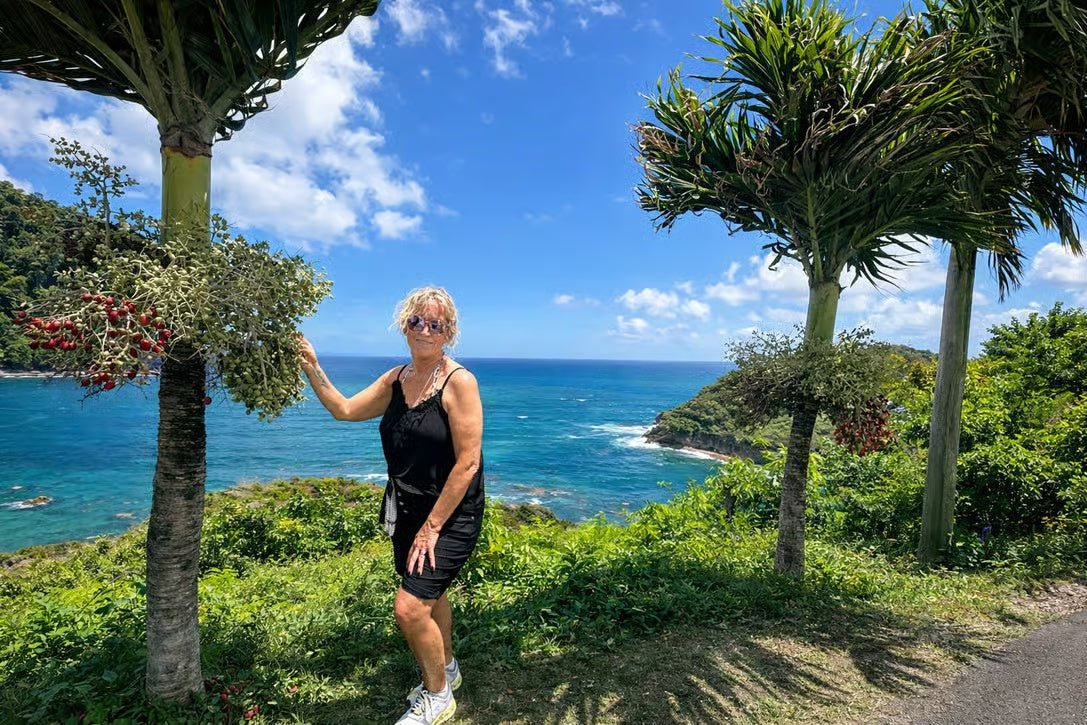 Traveler enjoying lush tropical vegetation and sea views in Saint Lucia