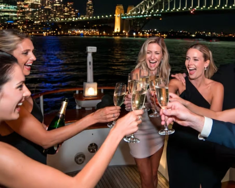 Guests enjoying champagne on Sydney Harbour New Year's Eve cruise