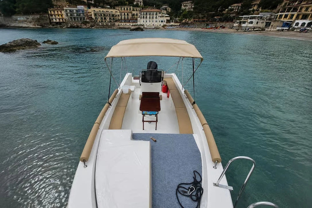 Shaded seating and wooden table on the private boat
