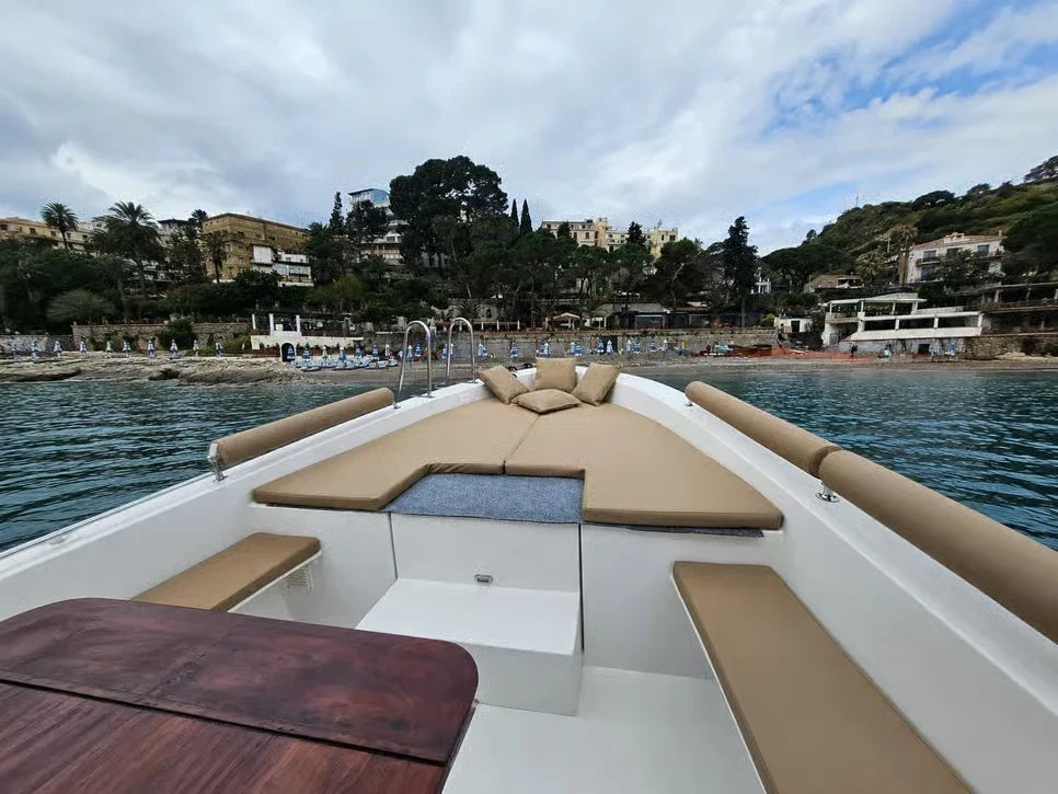 Comfortable boat sun deck overlooking Taormina
